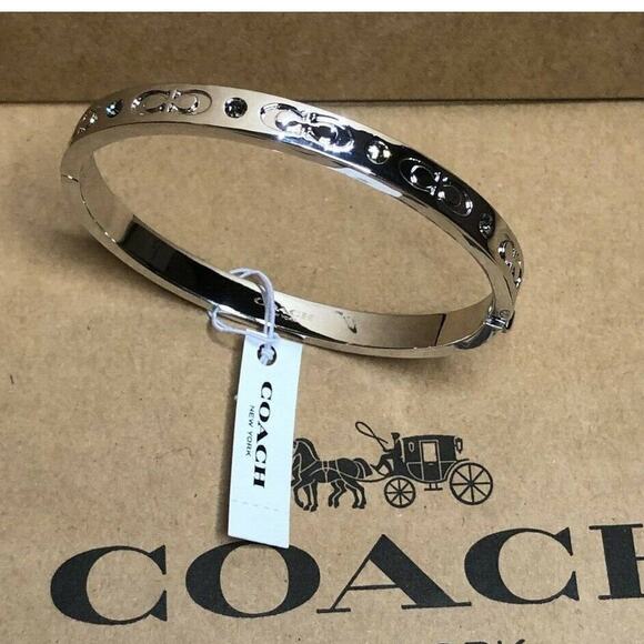 COACH SILVER TONE KISSING C HINGED BANGLE BRACELET - Picture 1 of 10